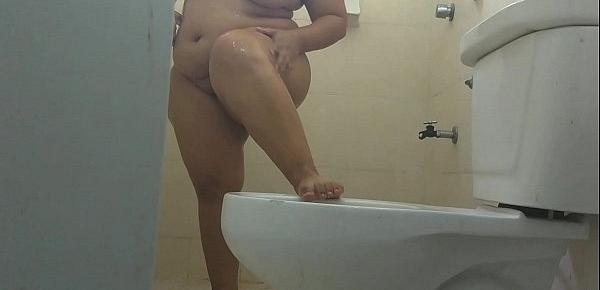  Young girl with big buttocks bathing, washing her buttocks and rubbing her wet vagina